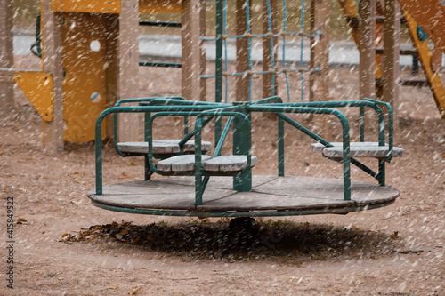 Children's Playground During Snowfall. The concept of the First Snow, Cold, Winter, Frost, Bad Weather