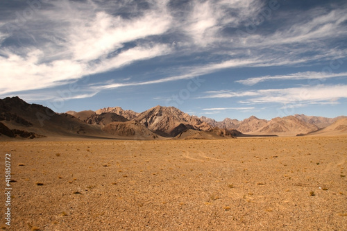 Panoramic view of high-altitude red desert on the Pamir Highway between Murghab and Ak Baital pass, Gorno-Badakshan, Tajikistan