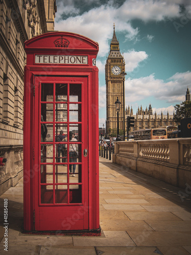 Street photo of phone booth with Big Ben in the background in London