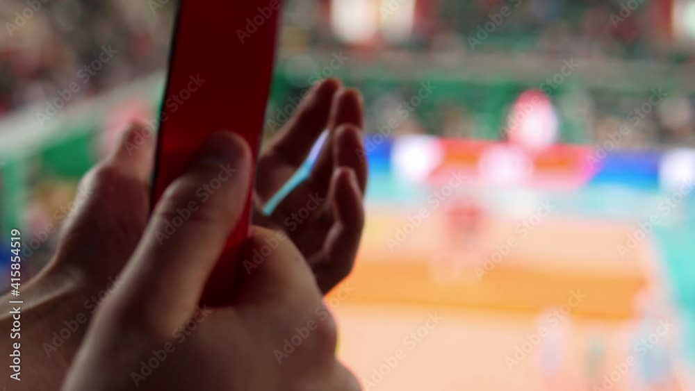 Sport fan clapping hands, watching game at stadium, supporting favorite player. Close up of a fan's hand Sport fan clapping hands, watching game at stadium, supporting favorite player. Close up of a fan's hand