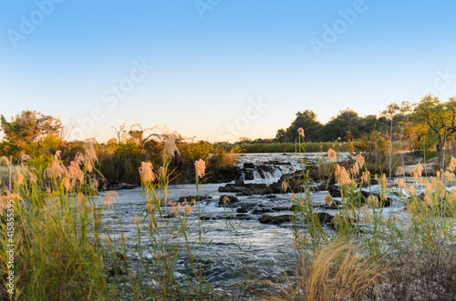Popafälle in Namibia im Abendlicht - Caprivi Streifen Afrika / Popa Falls in Namibia in the evening light - Caprivi Strip Africa
