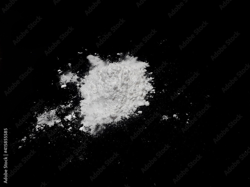 Cocaine drug powder pile on black background Cocaine drug powder pile on black background