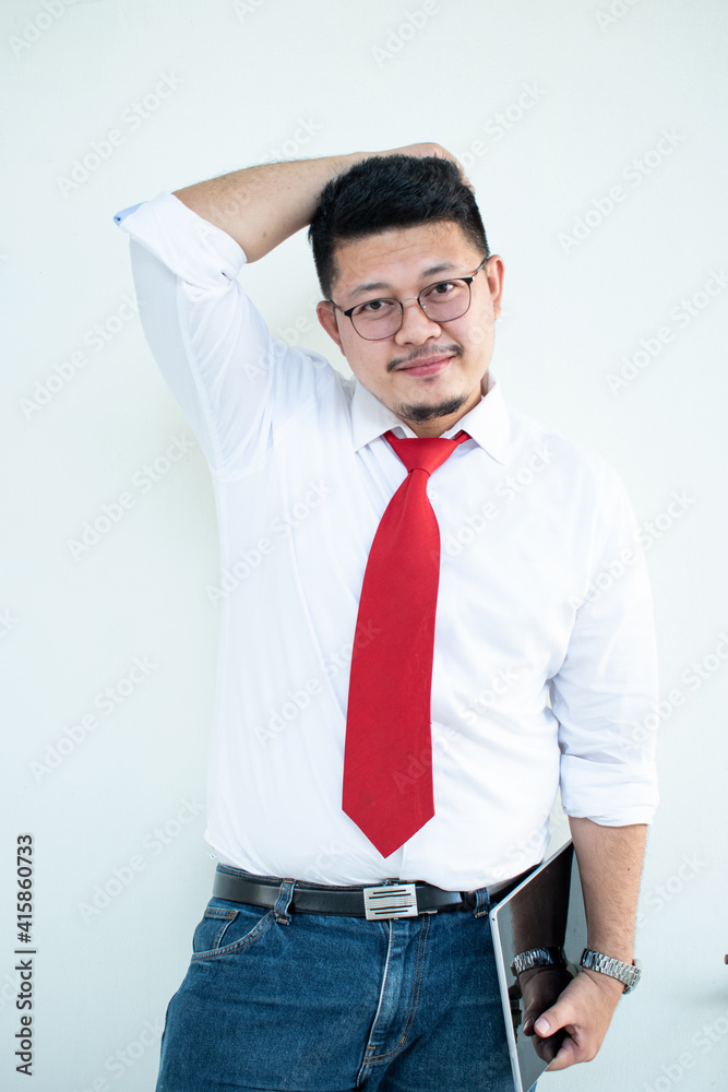 Expert in digital technologies. Cheerful young man in formal wear working on digital tablet and smiling while standing isolated on white background Expert in digital technologies. Cheerful young man in formal wear working on digital tablet and smiling while standing isolated on white background