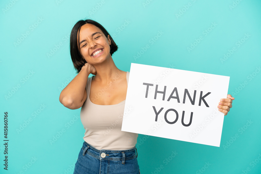 Young mixed race woman isolated on blue background holding a placard with text THANK YOU and thinking Young mixed race woman isolated on blue background holding a placard with text THANK YOU and thinking