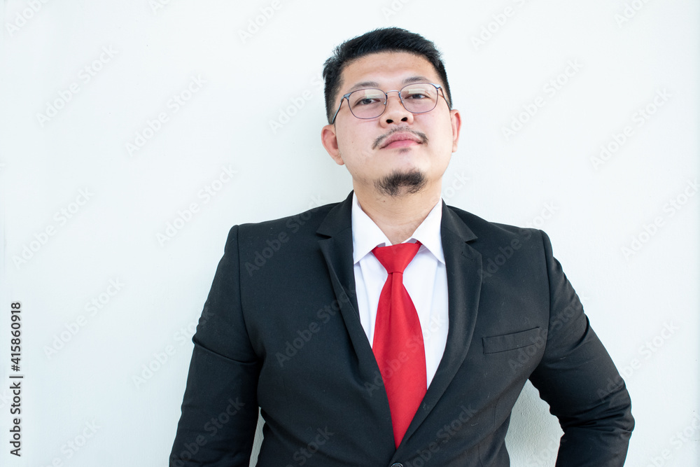 Handsome young business man wear glasses red tie in a suit and west. Handsome young business man wear glasses red tie in a suit and west.
