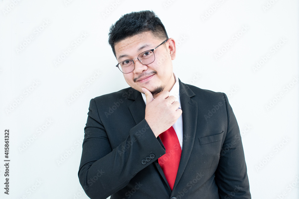 Handsome young business man wear glasses red tie in a suit and west. Handsome young business man wear glasses red tie in a suit and west.