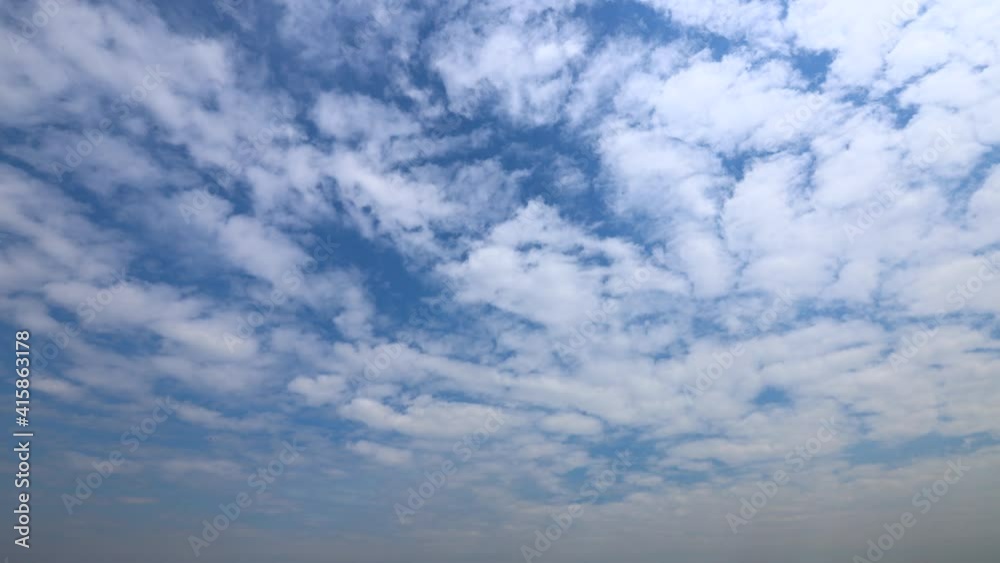 Sunny blue sky with light clouds. Beautiful clouds flying in the air. Time-lapse. Atmospheric weather phenomena. 4K Sunny blue sky with light clouds. Beautiful clouds flying in the air. Time-lapse. Atmospheric weather phenomena. 4K