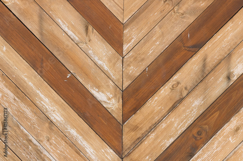 Aged wooden background of brown boards with joint in the middle - horizontal