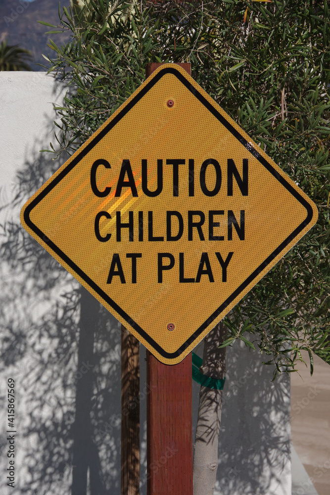 Close-up view of a traffic sign CAUTION CHILDREN AT PLAY