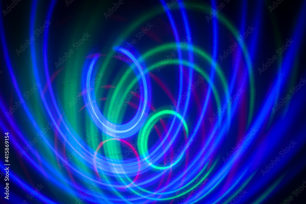 abstract background, colored circles on a black background, circles in motion abstract background, colored circles on a black background, circles in motion