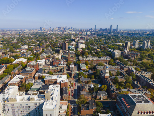 Фотография Aerial view of historic city center of Cambridge on Mt Auburn Street with Boston modern city skyline at the background, Cambridge, Massachusetts MA, USA