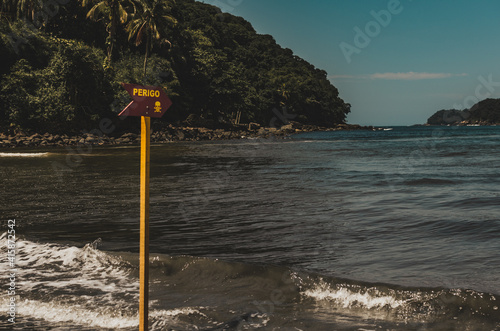 warning danger sign at the brazilian beach photo