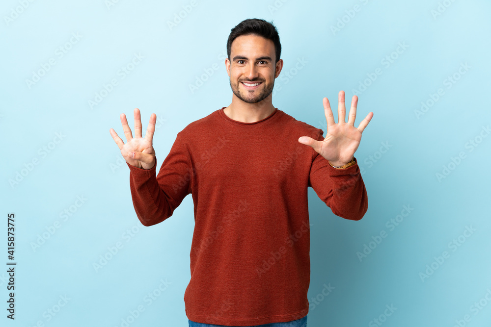 Young handsome man over isolated background counting nine with fingers Young handsome man over isolated background counting nine with fingers