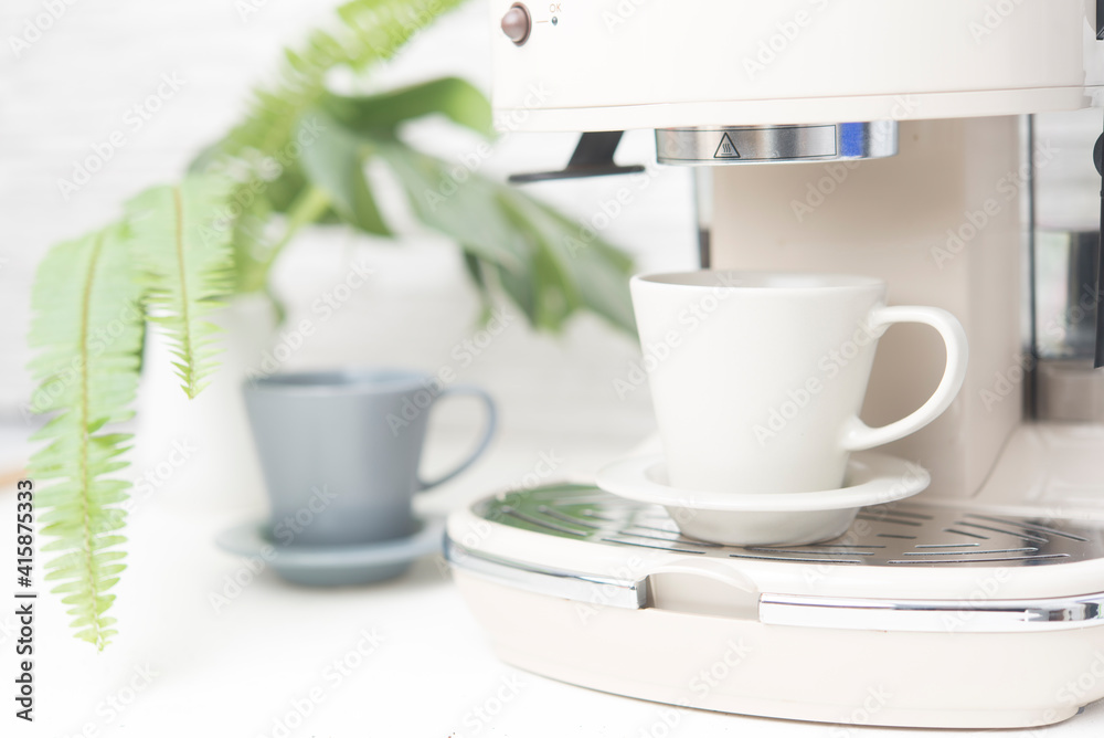 Coffee maker close up white scene Coffee maker close up white scene