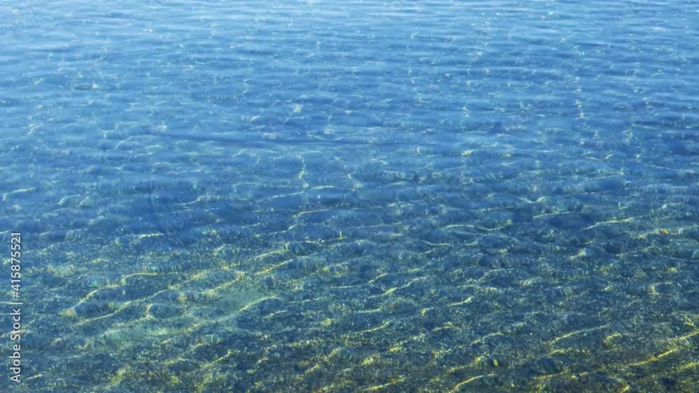 Reflets de lumière azur par les vagues Reflets de lumière azur par les vagues