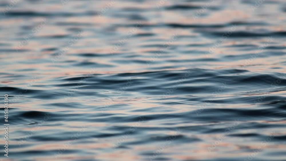 Close up of gentle waves on a lake at sunset. Close up of gentle waves on a lake at sunset.
