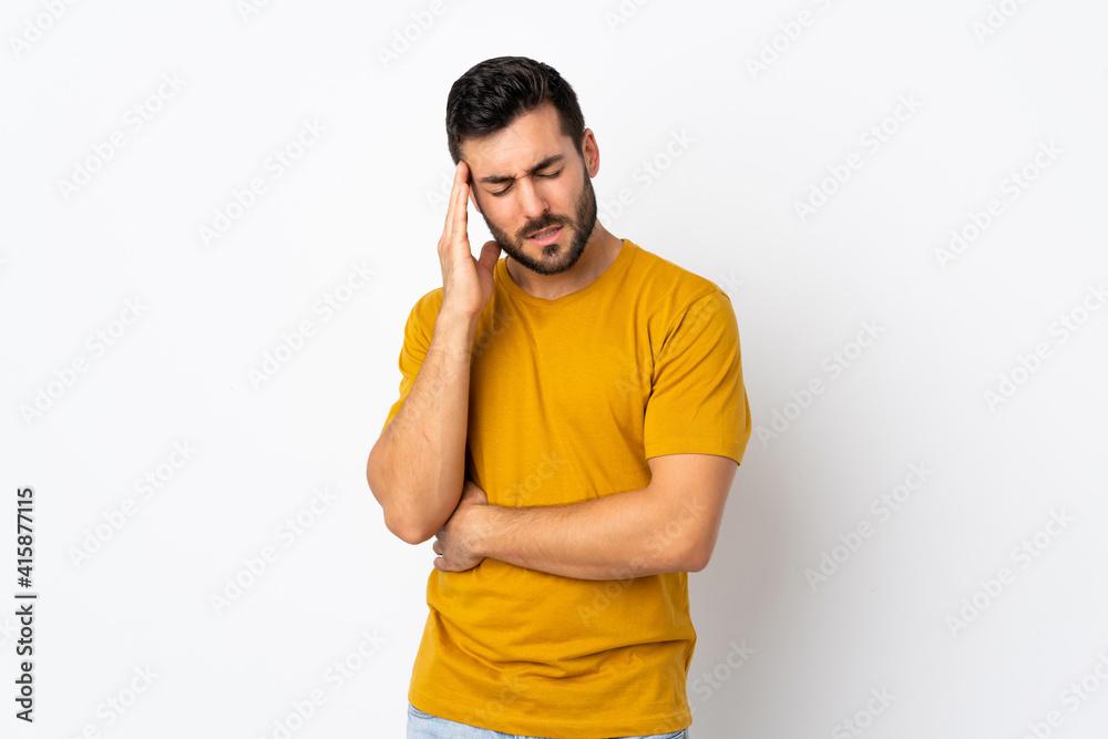 Young handsome man with beard isolated on white background with headache Young handsome man with beard isolated on white background with headache