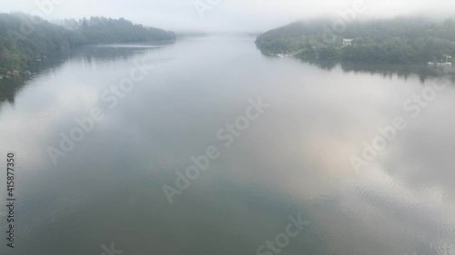 Beautiful River rapids in the fog in the morning. River water landscape. Flying from the drone through the morning fog over the river. Beautiful landscape. Forest river flow