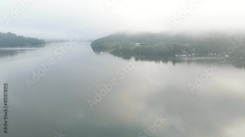 Beautiful River rapids in the fog in the morning. River water landscape. Flying from the drone through the morning fog over the river. Beautiful landscape. Forest river flow