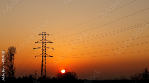Electric pole at sunset