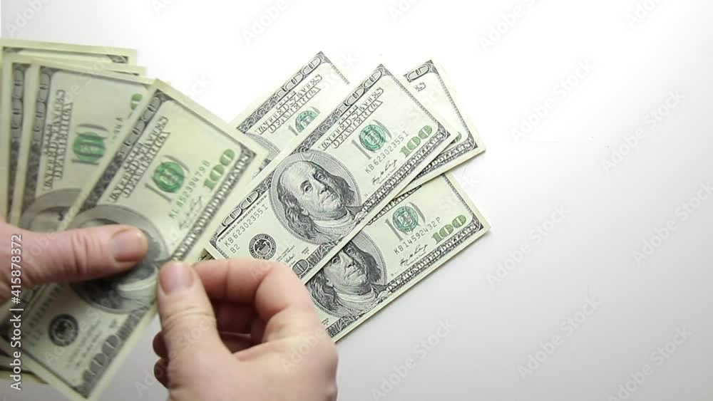hand holding money hand holding money