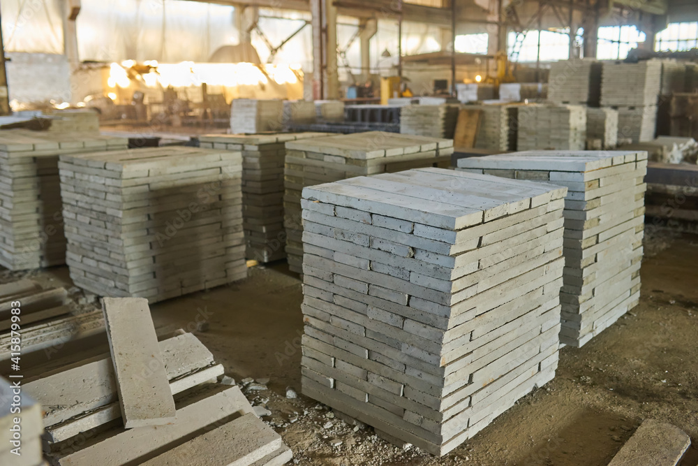 Paving slabs factory. Tiles piled in pallets. Paving slabs factory. Tiles piled in pallets.