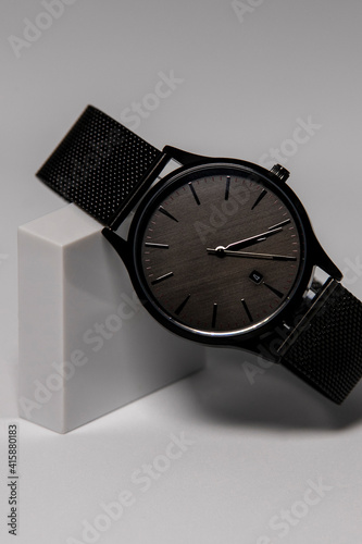 Luxury wristwatch on white background, close-up. Space for text