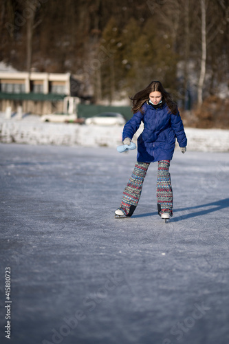 Child ice skating on frozen canal 