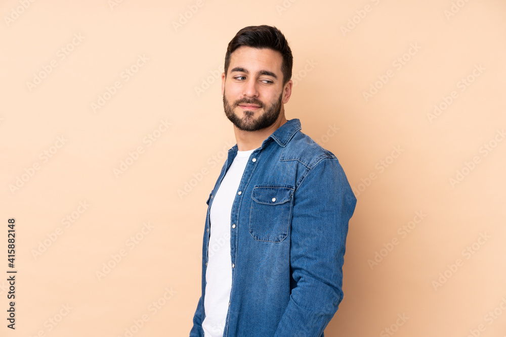 Caucasian handsome man isolated on beige background . Portrait Caucasian handsome man isolated on beige background . Portrait