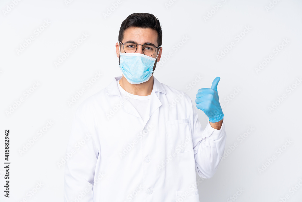 Young dentist man isolated on white background 