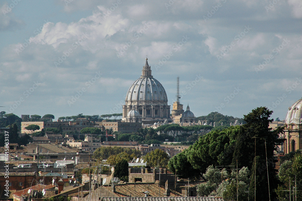 View over the rooftops of Rome with the St. Peter's Basilica in the middle