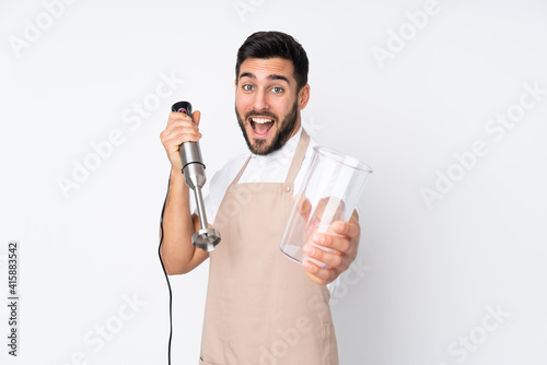 Man using hand blender isolated on white background