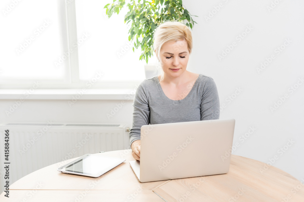 Happy Young Beautiful Woman Using Laptop, Indoors. Happy Young Beautiful Woman Using Laptop, Indoors.