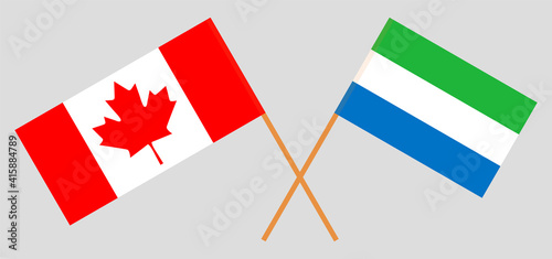 Crossed flags of Canada and Sierra Leone. Official colors. Correct proportion