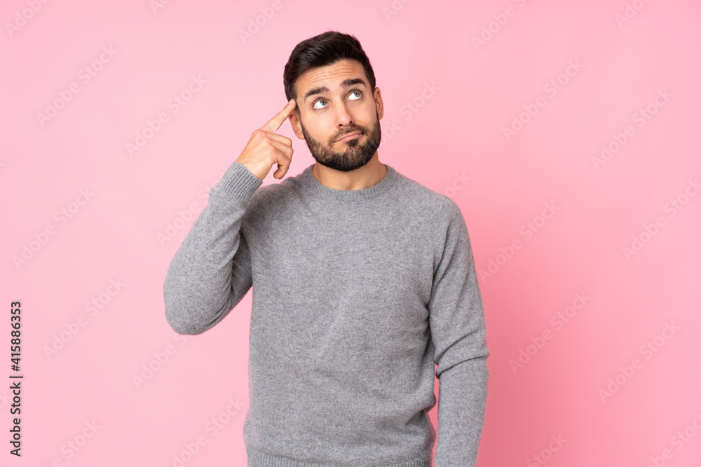 Caucasian handsome man over isolated background making the gesture of madness putting finger on the head Caucasian handsome man over isolated background making the gesture of madness putting finger on the head