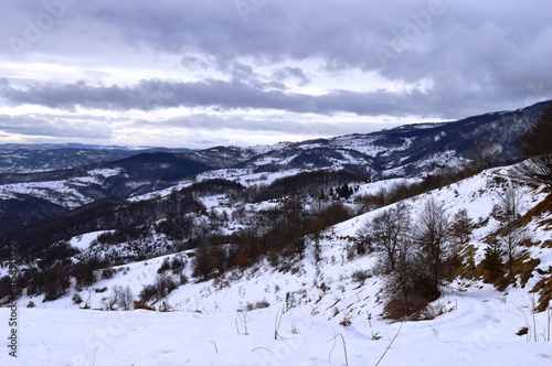 winter landscape of mountains and hills in the snow © oljasimovic