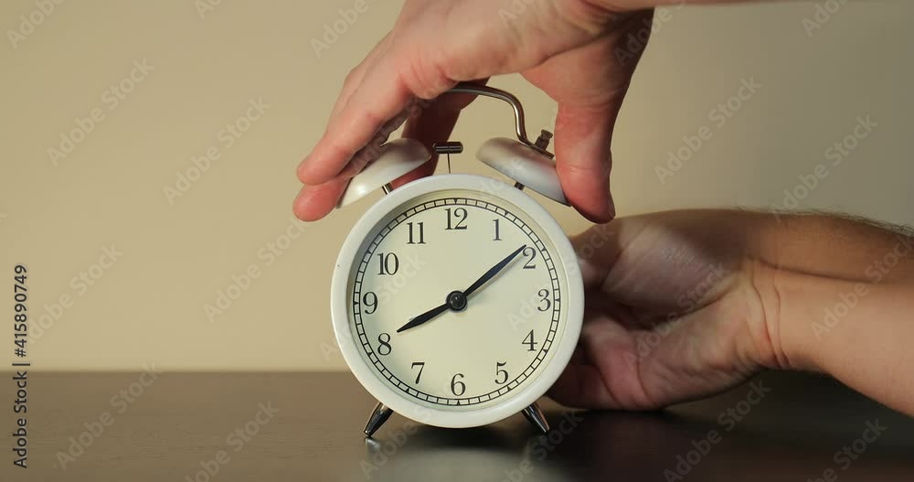 Setting clock back by one hour for ending summer daylight saving time in the autumn in October