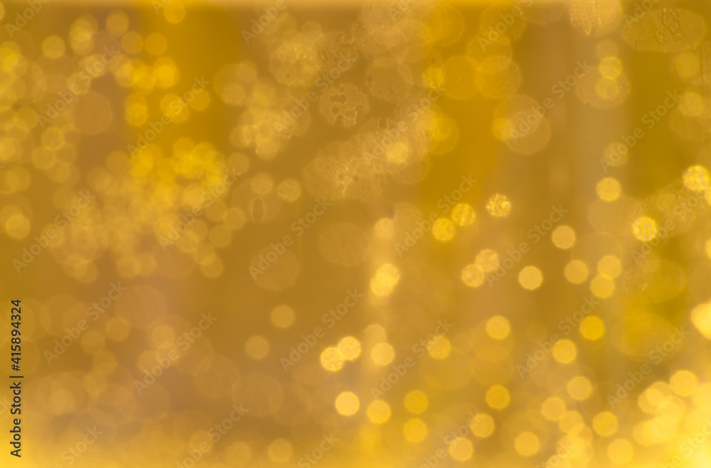 Yellow gold sparkly background with bokeh Yellow gold sparkly background with bokeh