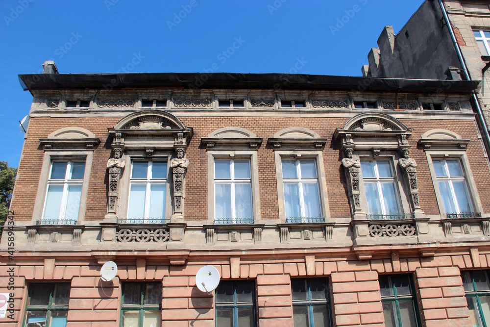 Historic building made of red bricks and big glass windows