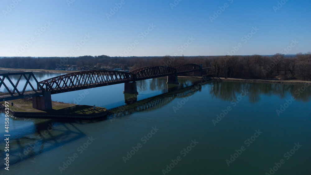 Bridge at summer with a blue sky in the Horizon . The picture was taken by a drone. the River unter the Bridge called Rhein.  