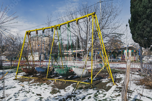 Georgia, Tbilisi. Abandoned rusty playgrounds and attractions.
