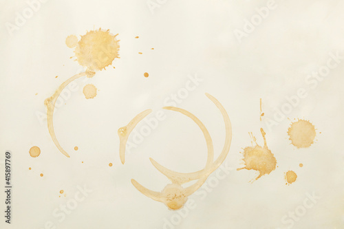 Coffee spots on white paper photo