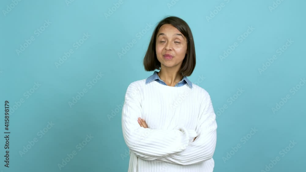 Young brunette woman looking up over isolated background
