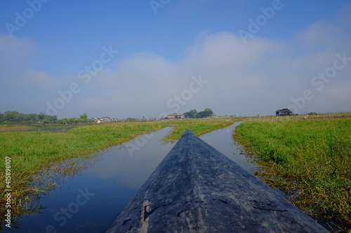 Taking a smooth boat trip on Inle lake in Myanmar.