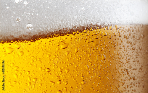 Beer background with bubble froth texture foam pouring alcohol soda in glass happy celebration party holiday new year concept object design