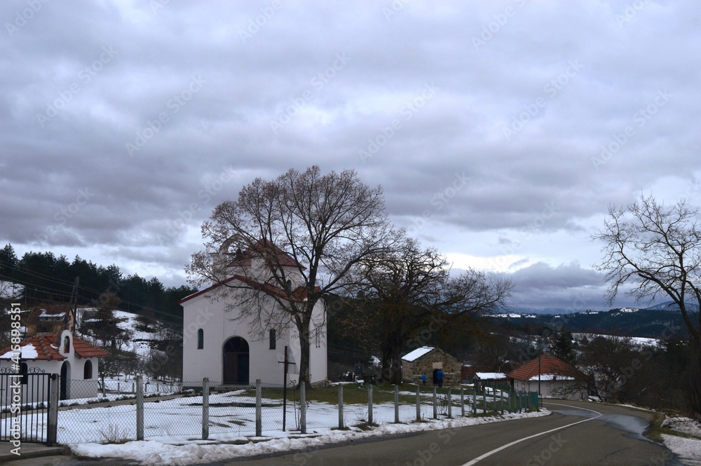 two old churches in the village in winter two old churches in the village in winter