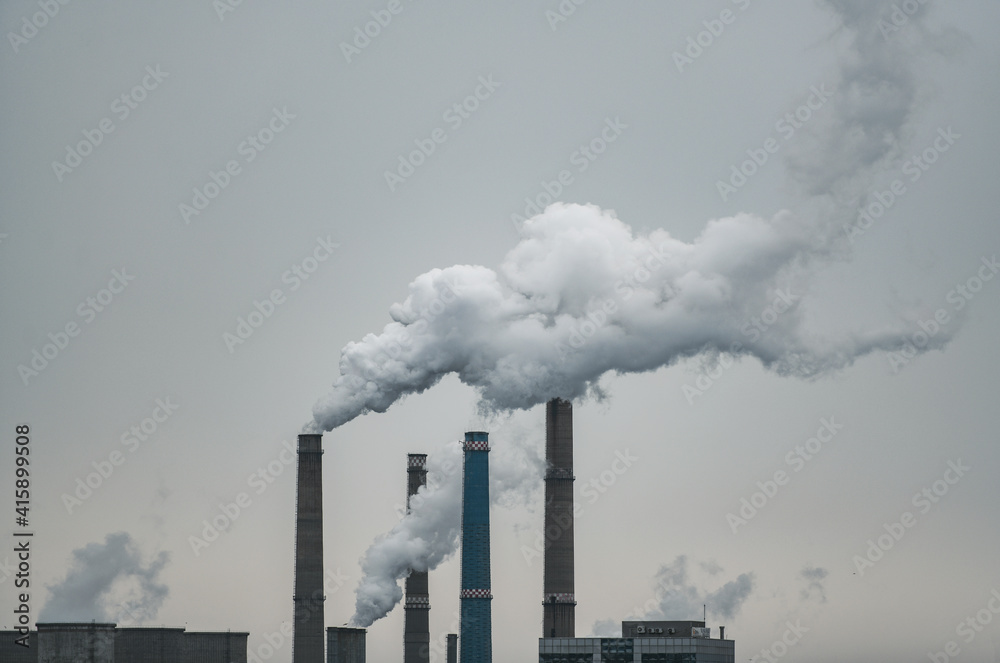 Air pollution concept - smoke from chimneys of power plant