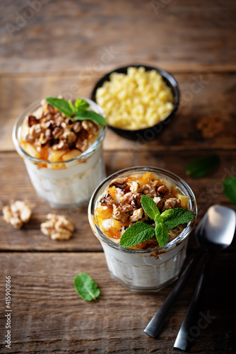 Greek yogurt millet caramelized apple walnuts parfait in a glass