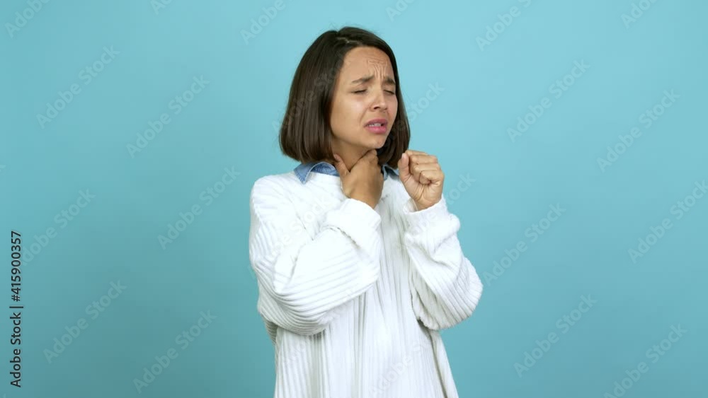 Young brunette woman is suffering with cough and feeling bad over isolated background Young brunette woman is suffering with cough and feeling bad over isolated background
