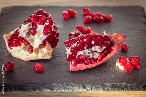 juicy pomegranate. Natural appearance in the kitchen, pieces of fruit healthy and full of vitamins